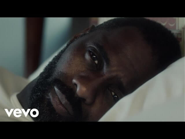 Watch Idris Elba get tactile in the new video for Mumford & Sons' "Lover Of The Light"