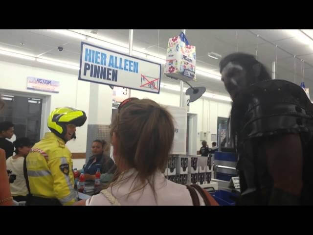 Watch Dutch shoppers react as a 7-foot-tall orc wanders a supermarket