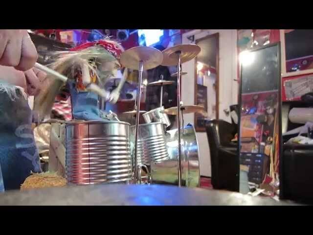 This little puppet mastered Rush’s “Tom Sawyer” on drums, so what’s your excuse?