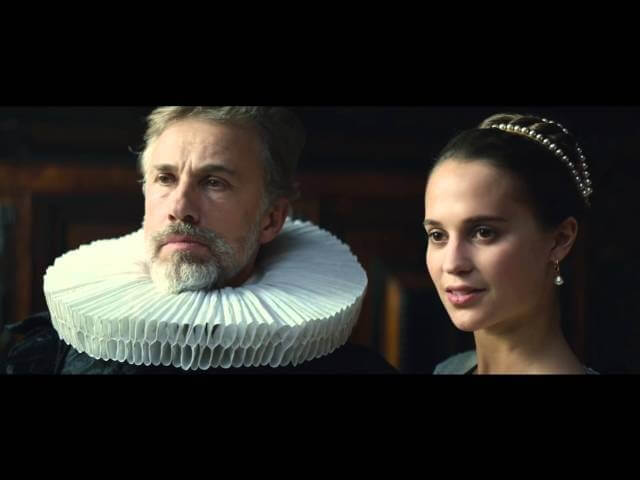 Alicia Vikander and Christoph Waltz pose for a portrait in the Tulip Fever trailer