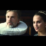 Alicia Vikander and Christoph Waltz pose for a portrait in the Tulip Fever trailer