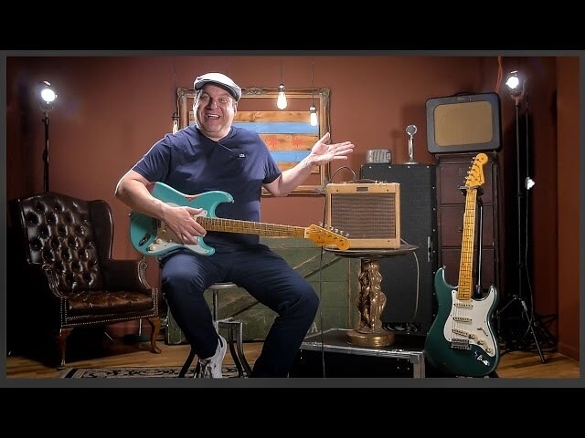 Jeff Garlin shows off a guitar he insists was manufactured by unicorns