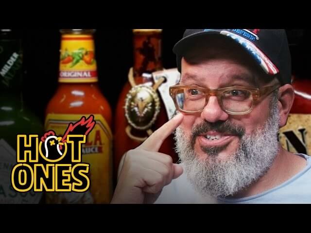 Watch David Cross wound himself with increasingly brutal hot wings