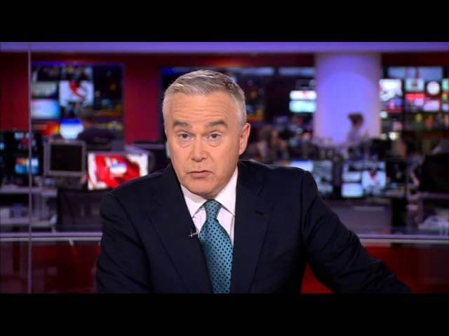 BBC newsman Huw Edwards always strikes this same pose