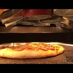 Here’s Alton Brown cooking a pizza with an enormous Easy-Bake Oven