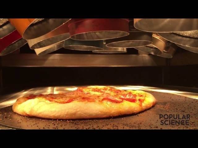 Here’s Alton Brown cooking a pizza with an enormous Easy-Bake Oven