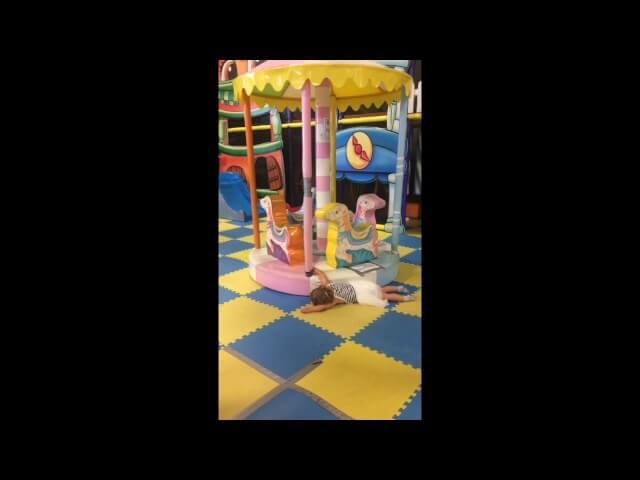 Little girl dragged in circle by merry-go-round in perfect metaphor for life