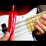Guy plays Red Hot Chili Peppers using a red hot chili pepper