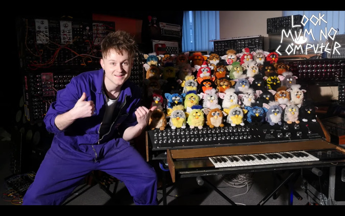 Please enjoy several dozen Furbies, mounted to an organ and screaming in agony