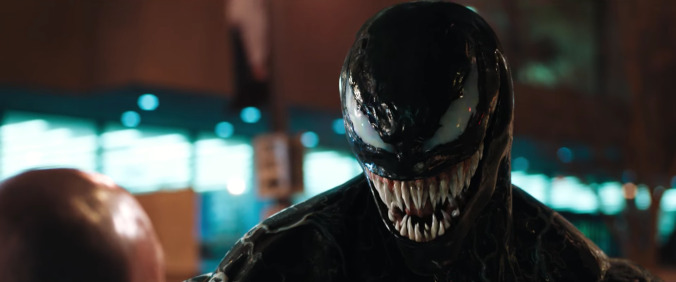 Tom Hardy shows off his toothy grin in the first full Venom trailer