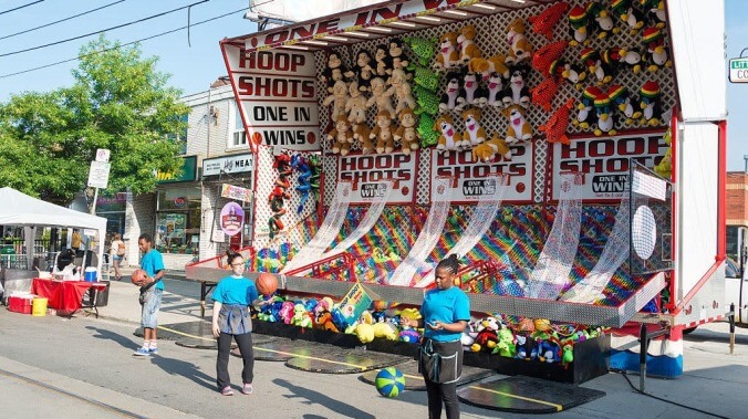 Meet the thin multicolored line protecting visitors from unscrupulous carnival games