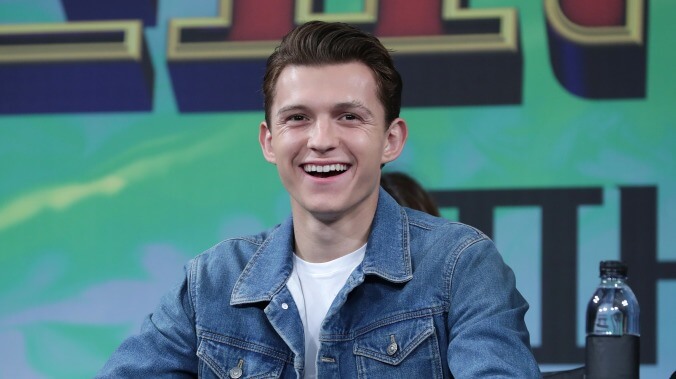 Tom Holland puts on his angry hair for the first image from the Russos’ new bank robber movie