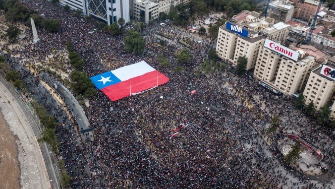 Chilean opera singer under curfew cheered after belting a song of protest from her window