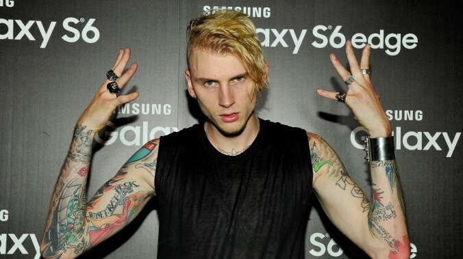 Watch Machine Gun Kelly dance on a boardroom table in front of some tired Interscope executives