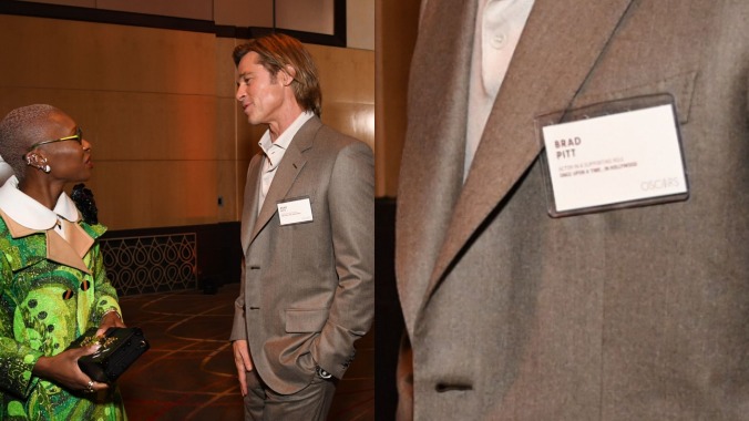 Put this photo of Brad Pitt and his helpful nametag in the Louvre