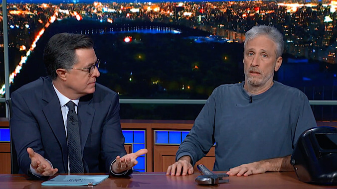 Jon Stewart premieres his new movie Irresistible from under Stephen Colbert's desk