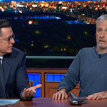 Jon Stewart premieres his new movie Irresistible from under Stephen Colbert's desk