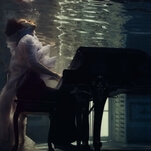 Harry Styles literally drowns his sorrows in a somber music video for "Falling"