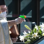 Priests now shooting (water) guns at babies and food