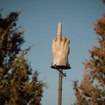 Watch a short documentary about the guy who built a giant wooden middle finger in his yard