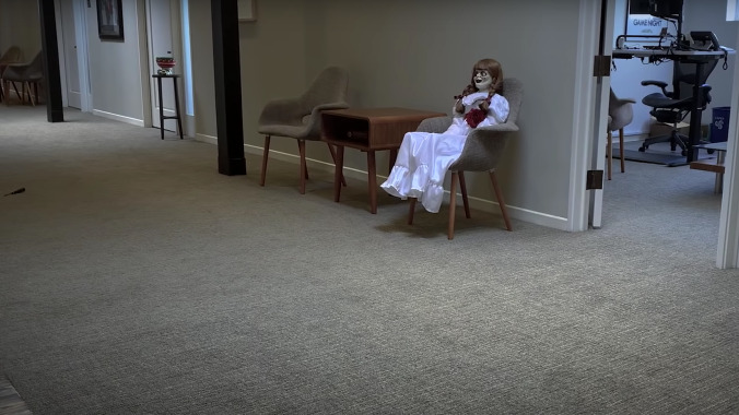 The Annabelle doll sure is bored with nobody at the New Line office to kill