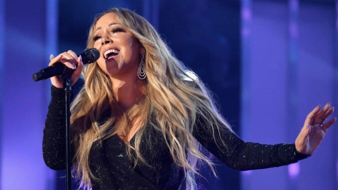 The oracle Mariah Carey, draped in mist, emerges from shrine to speak on Thanksgiving, dog hair