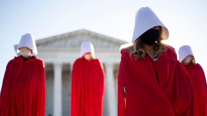 Protestors in Handmaid's Tale robes descend on Amy Coney Barrett Senate confirmation hearing