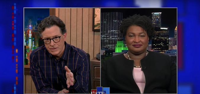 Voting champion Stacey Abrams tells Stephen Colbert to bet blue in tomorrow's Georgia runoff