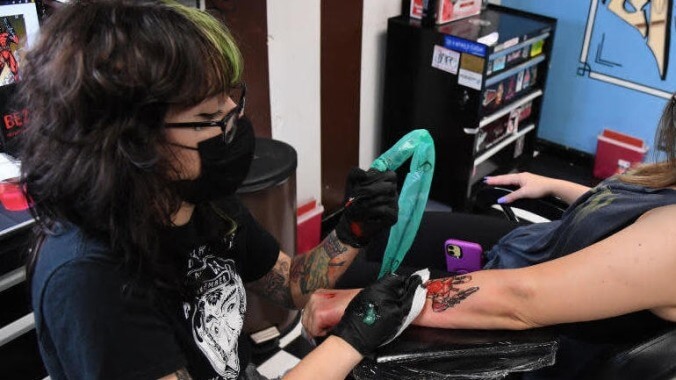 This woman, owner of the world's most unfortunately timed tattoo, exemplifies human resilience