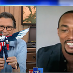 Stephen Colbert shows off his pre-release Captain America doll to an envious Anthony Mackie