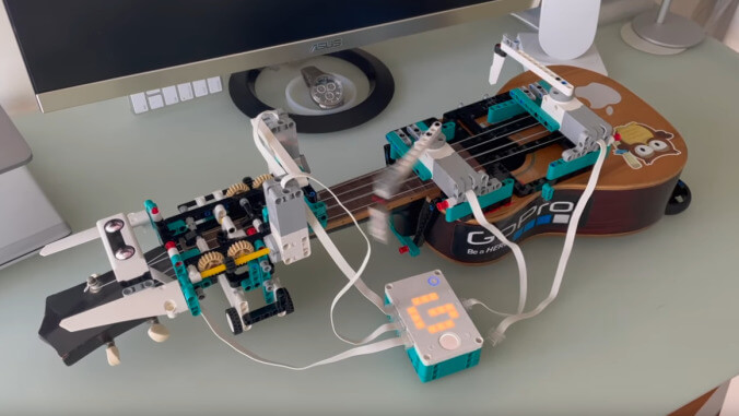 Just a Lego robot strumming a ukulele