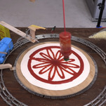 Today in needlessly complicated culinary robots: A toy train makes a pizza