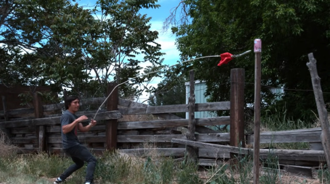 Rope dart maestro engages in mortal kombat with watermelon and soda cans