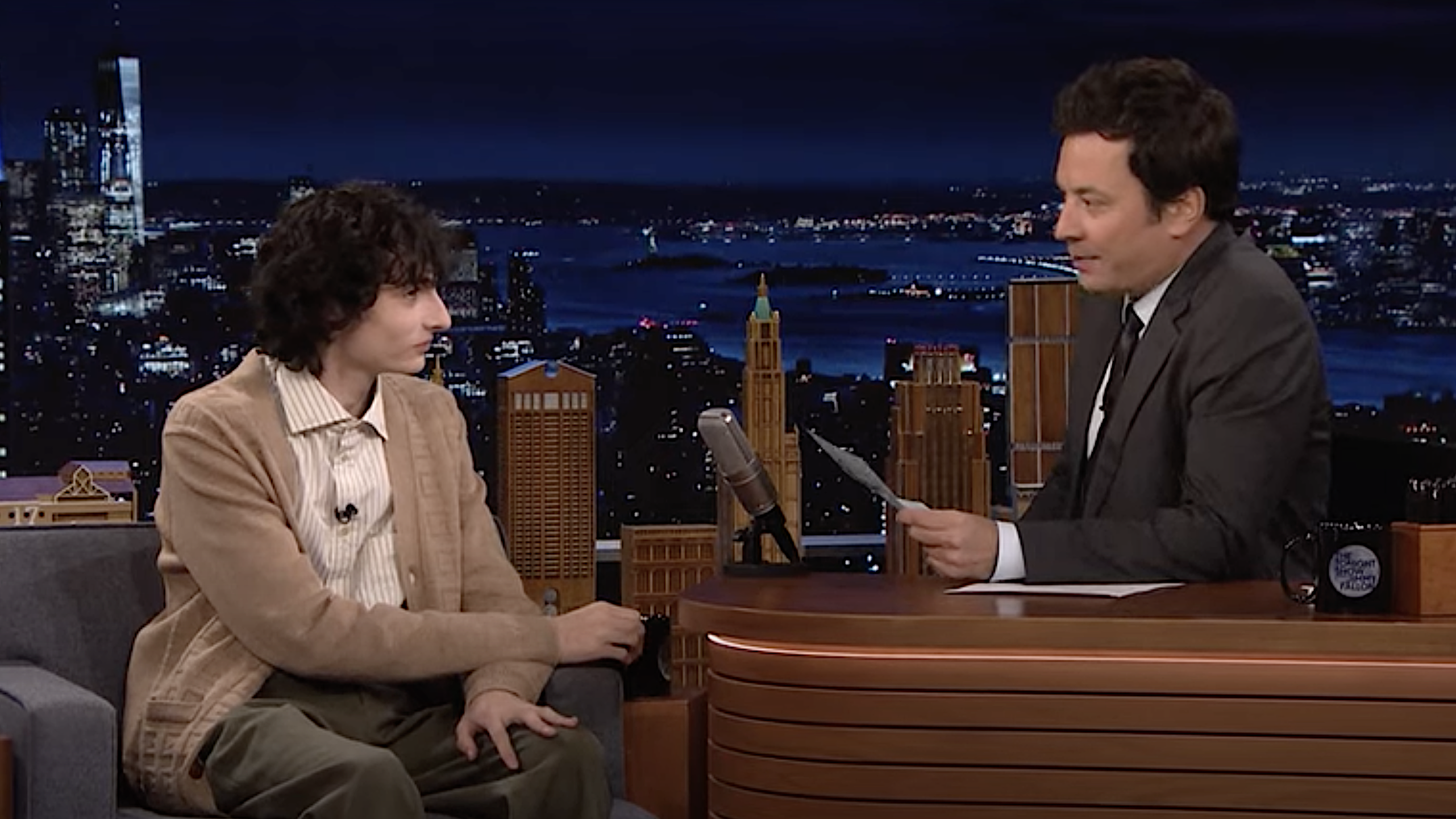 Finn Wolfhard practices his poker face while Jimmy Fallon asks about Stranger Things rumors