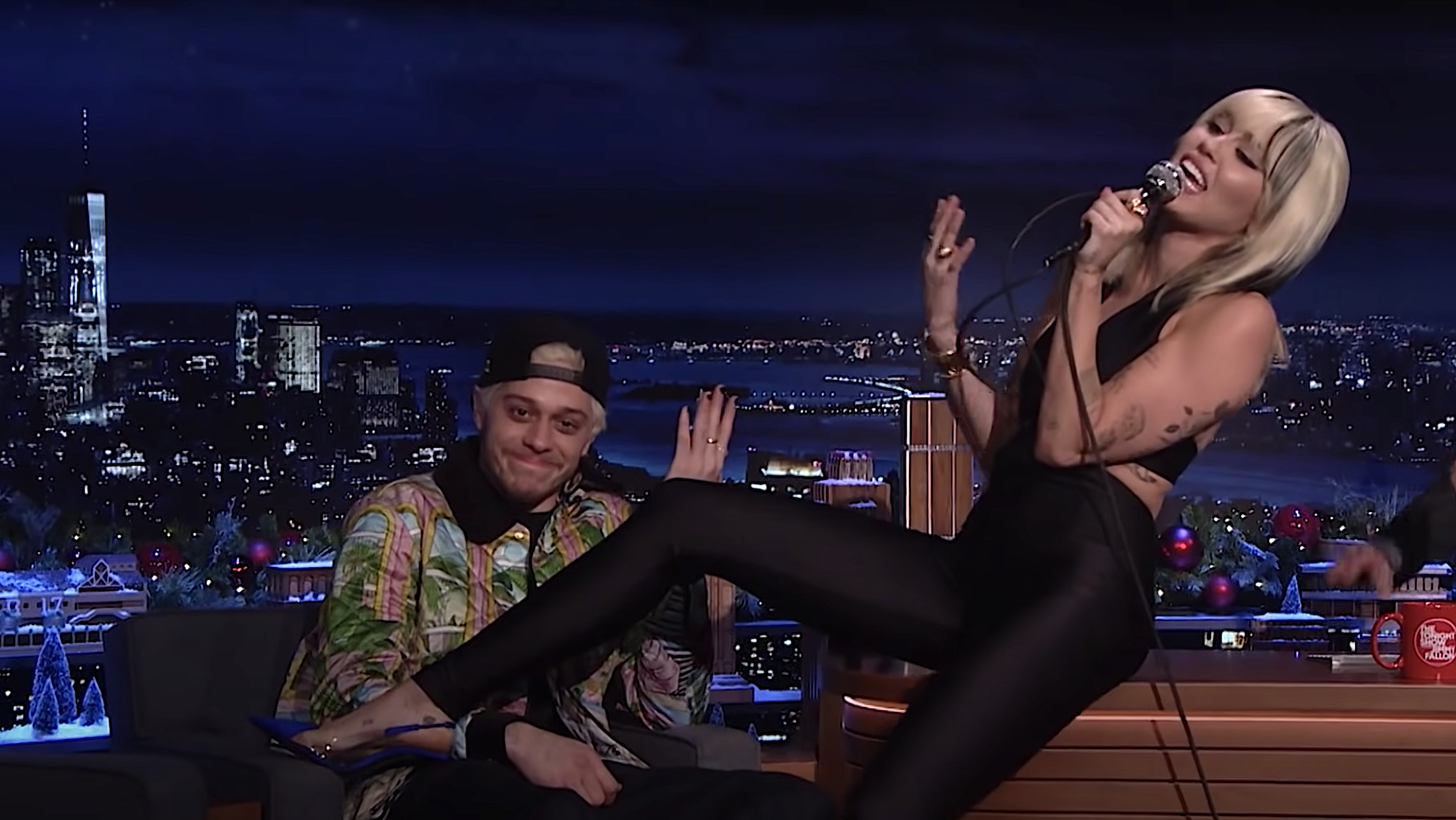 Fueling inevitable gossip, Miley Cyrus croons “It Should Have Been Me” to Pete Davidson