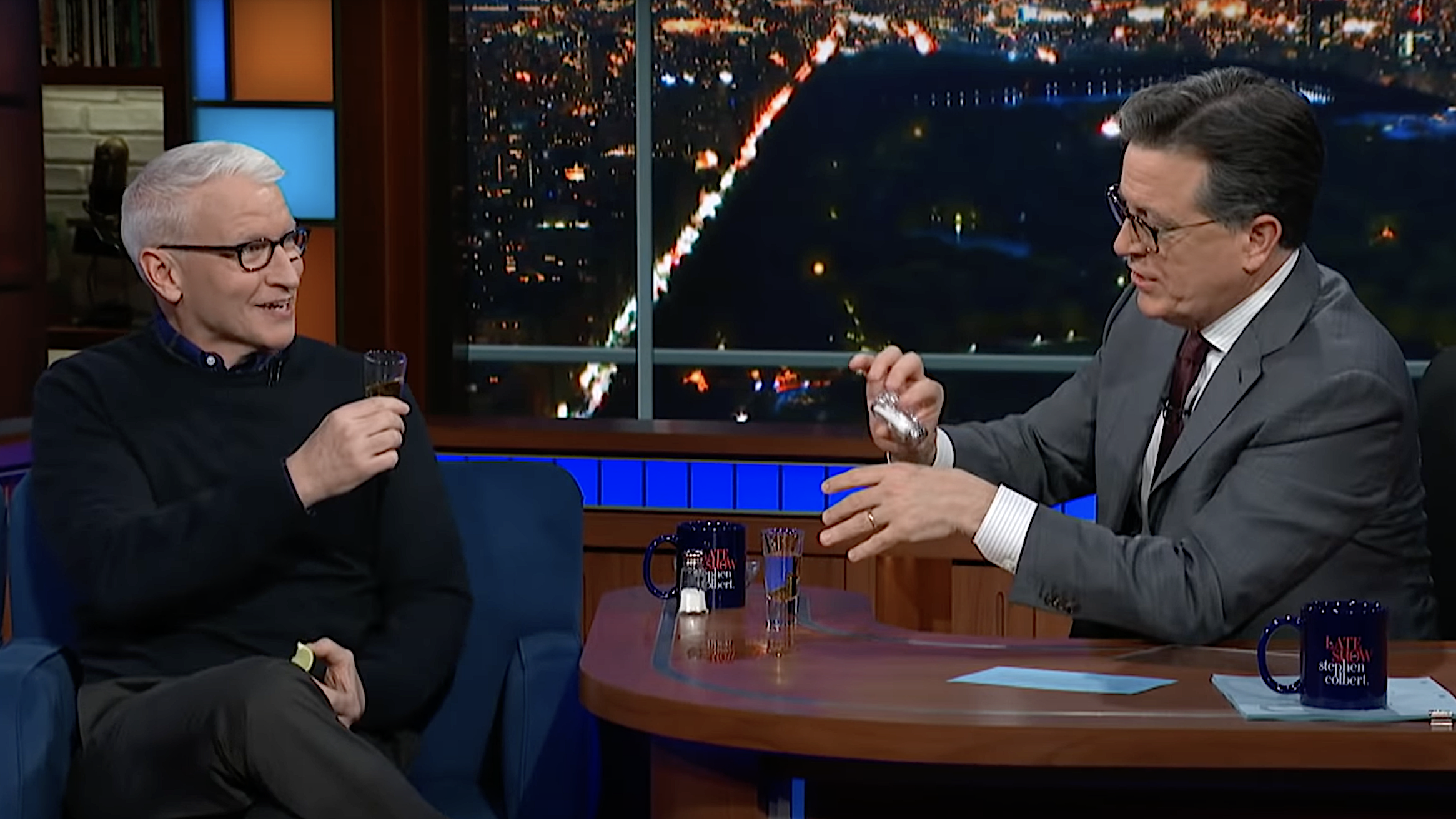 Anderson Cooper does shots with Stephen Colbert while discussing Chris Cuomo’s firing