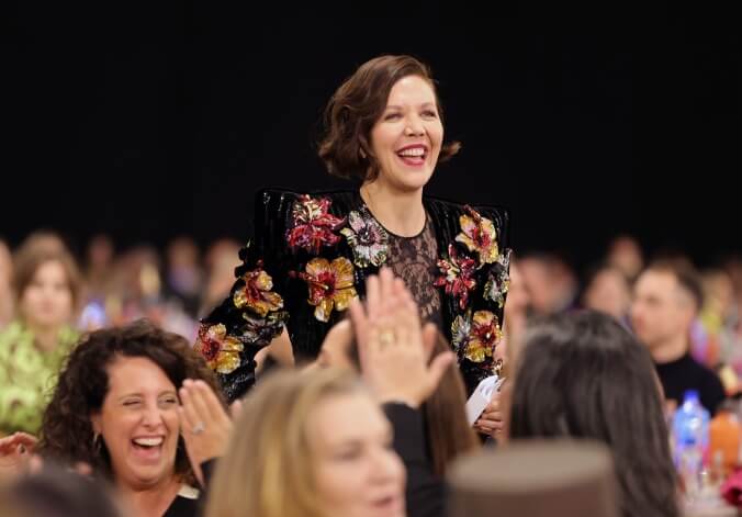 Maggie Gyllenhaal wears a path to the podium