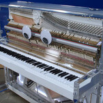 Custom-made super piano plays nearly impossible songs, kind of speaks English, and has googly eyes