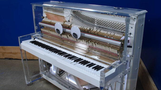 Custom-made super piano plays nearly impossible songs, kind of speaks English, and has googly eyes