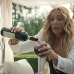 Toni Collette leads the mob with a gun and a glass of wine in hand in Mafia Mamma trailer