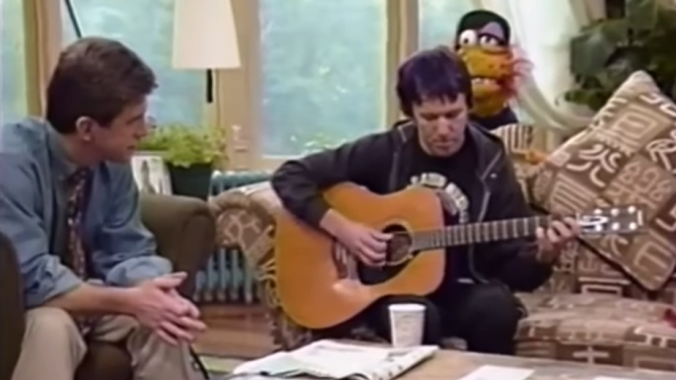Please enjoy Elliott Smith playing “Clementine” for Tom Bergeron and a puppet
