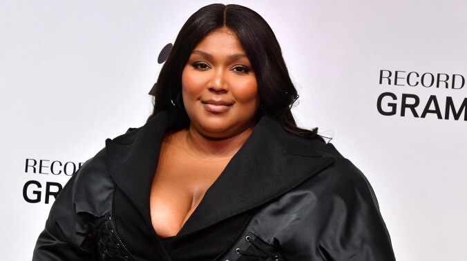 Lizzo was presented a humanitarian award by some of her backup dancers