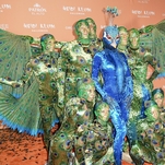 Halloween champion Heidi Klum dressed as a giant, multi-person peacock this year
