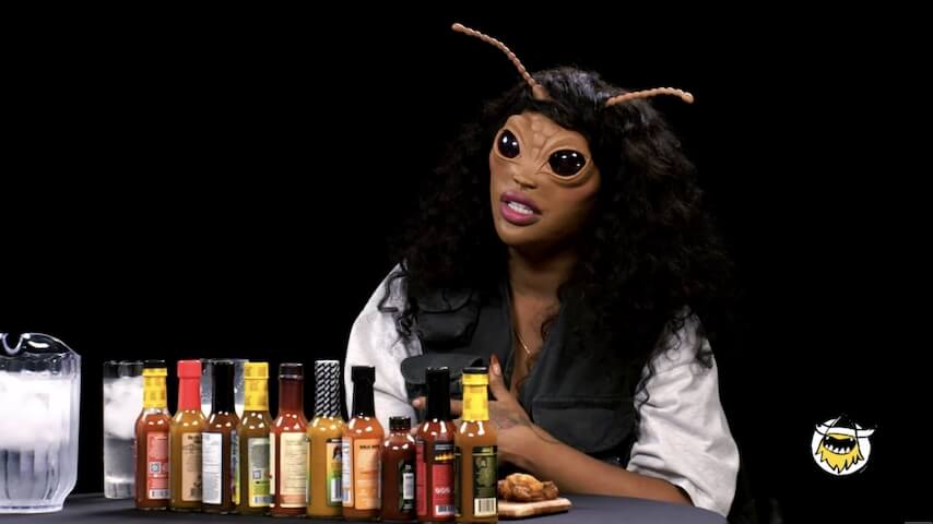 SZA, as a bug, grills Hot Ones' Sean Evans for a change