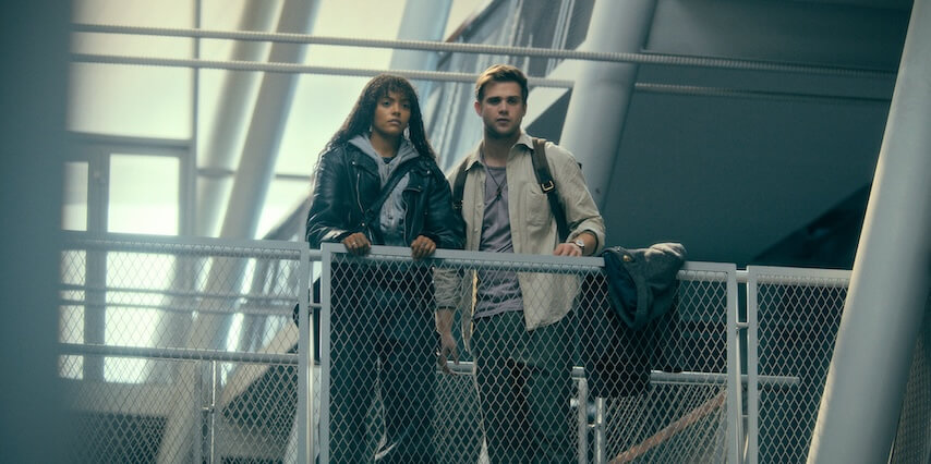 still of quintessa Swindell and leo woodall looking down from a walkway in prime target