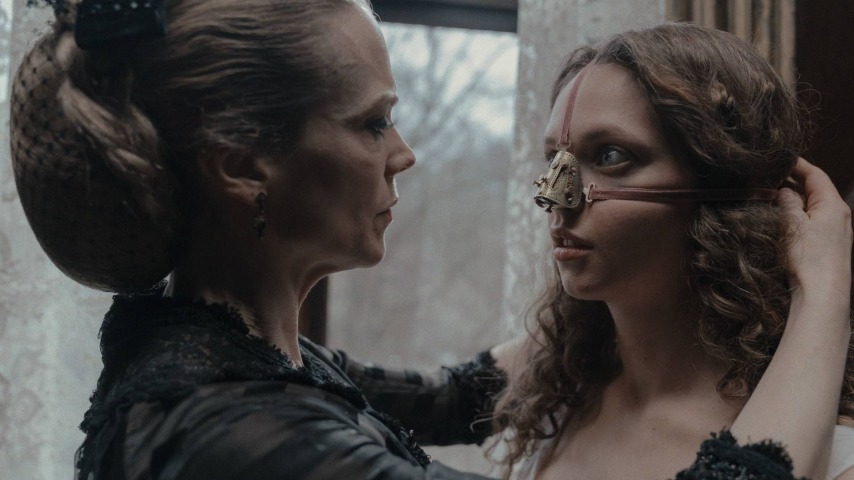 Ane Dahl Torp fixing a nose piece to Lea Myren in The Ugly Stepsister