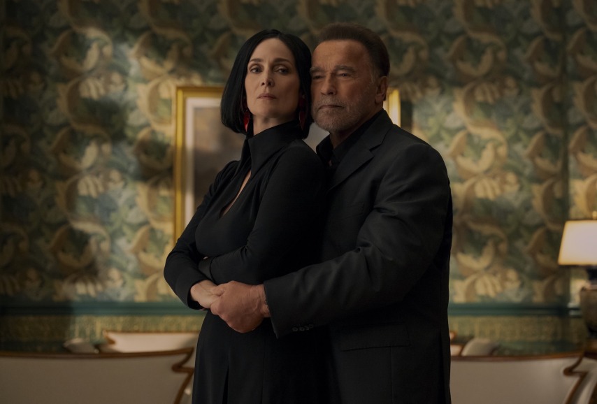 (L to R) Carrie-Anne Moss as Greta Nelso, Arnold Schwarzenegger as Luke Brunner in episode 202 of Fubar. Cr. Christos Kalohoridis/Netflix © (FUBAR season two first look)
