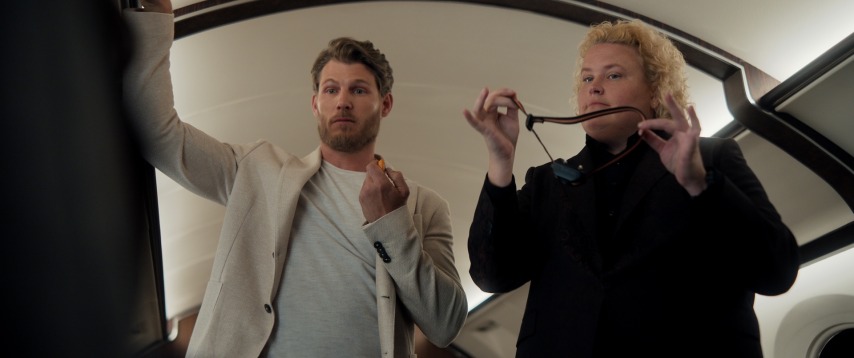 Travis Van Winkle as Aldon Reece, Fortune Feimster as Roo Russell in episode 203 of Fubar. Cr. Courtesy of Netflix © 2025 (FUBAR season two first look)