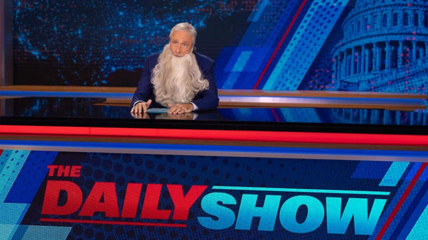 Jon Stewart with a fake beard on the Daily Show