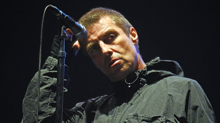 Liam Gallagher is sorry for tweeting a racial slur right before Oasis reunites